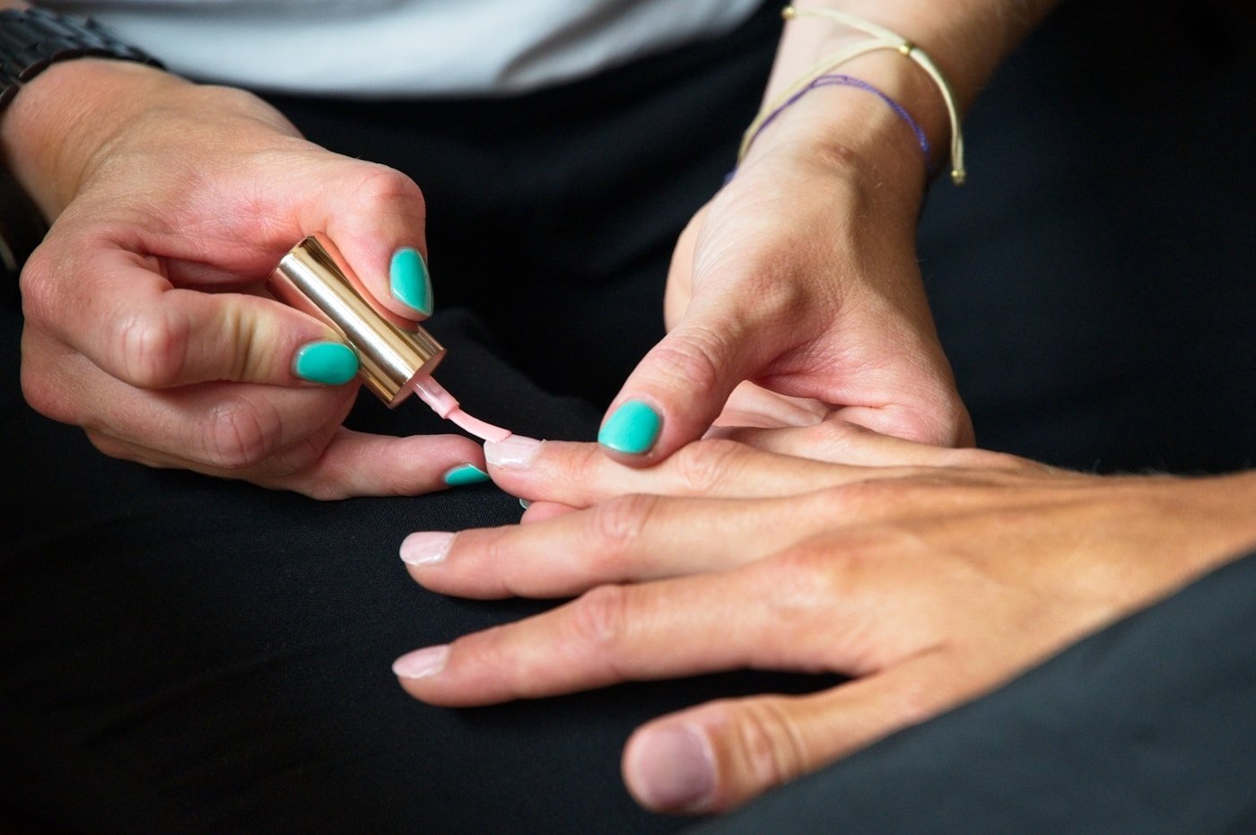 a persons hands with painted nails