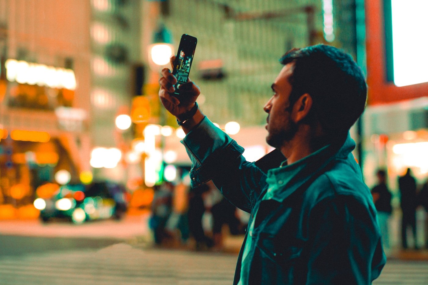 a man taking a picture with his cell phone